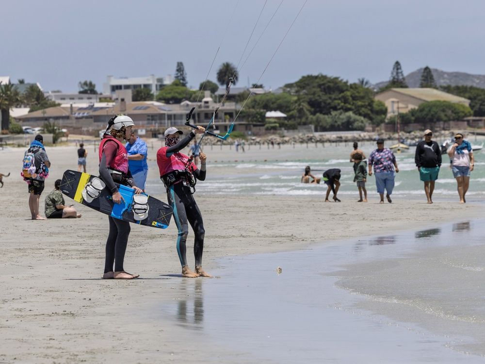 The beach at Langebaan in front of the town, kites and boards on the sand