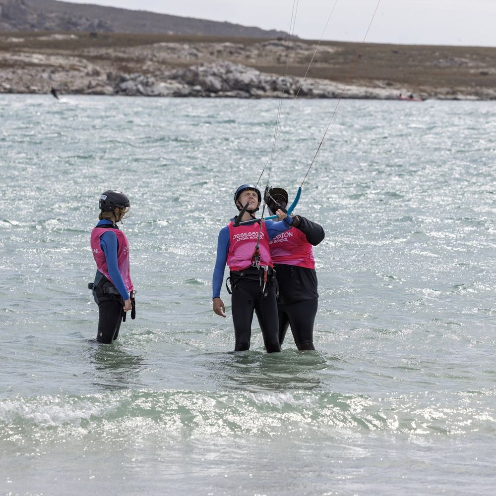 Students in the water waiting their turn during a group lesson