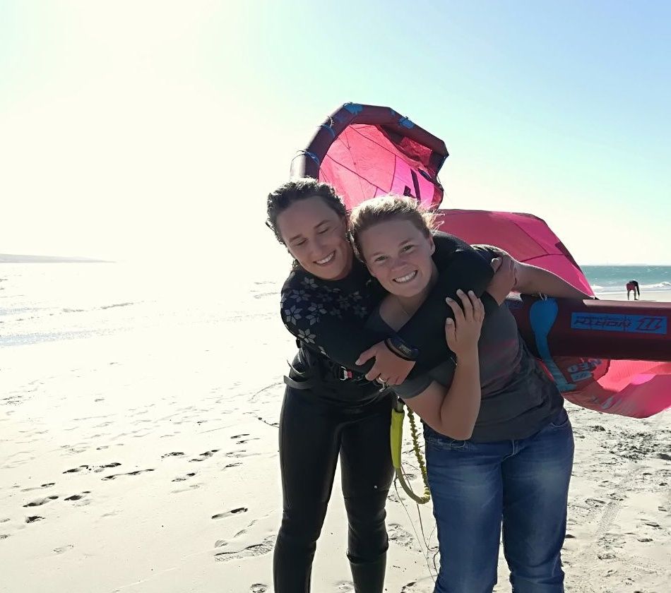 Megan and Shannon du Plessis on the beach at Langebaan after a session