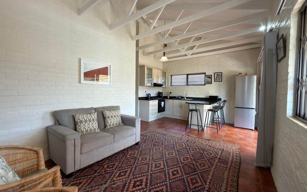 The open-plan living room and kitchen at Down Time